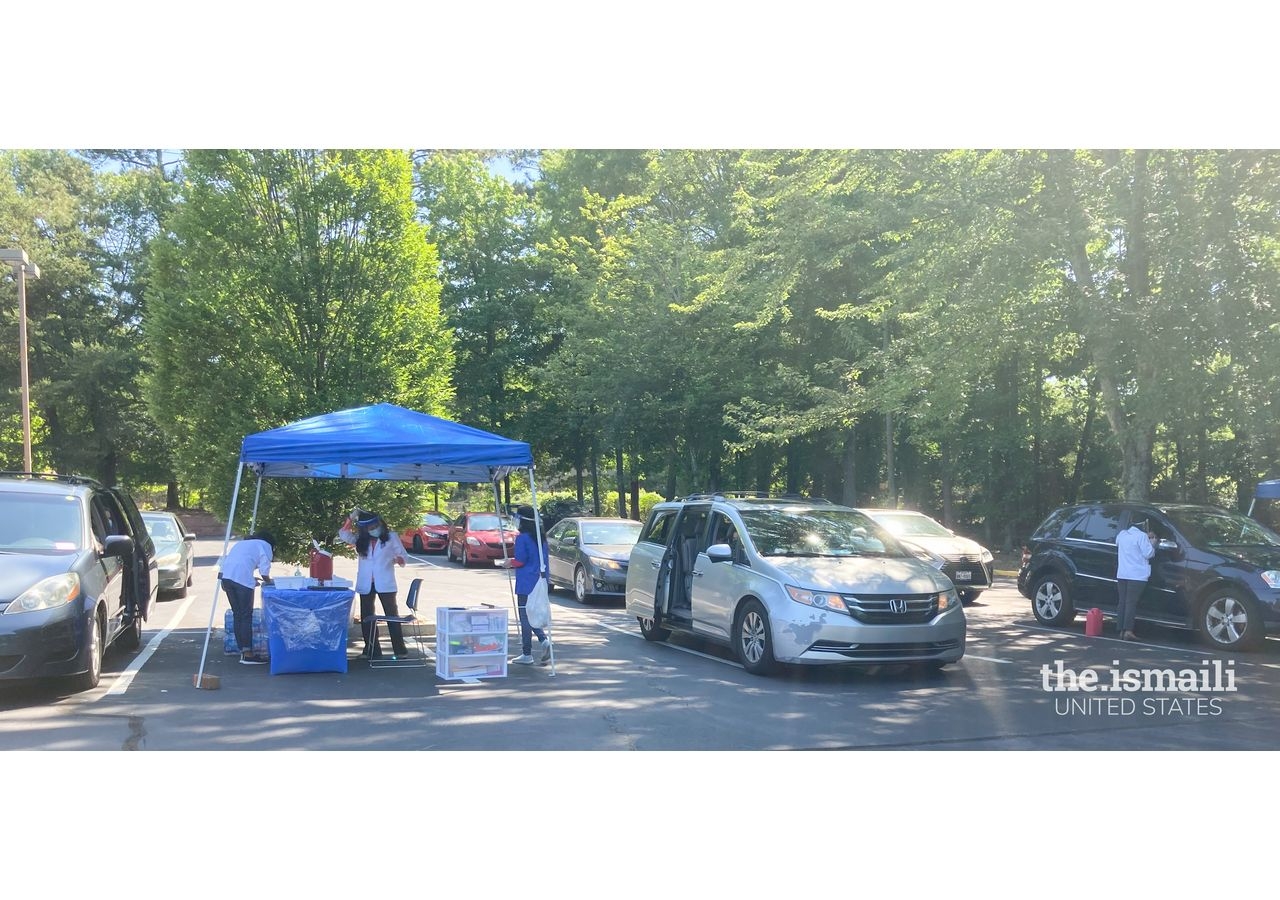 Cars line up at the Ismaili Jamatkhana in Atlanta, Georgia for the COVID-19 vaccination drive hosted by the Ismaili Council for the Southeastern US and Walmart.