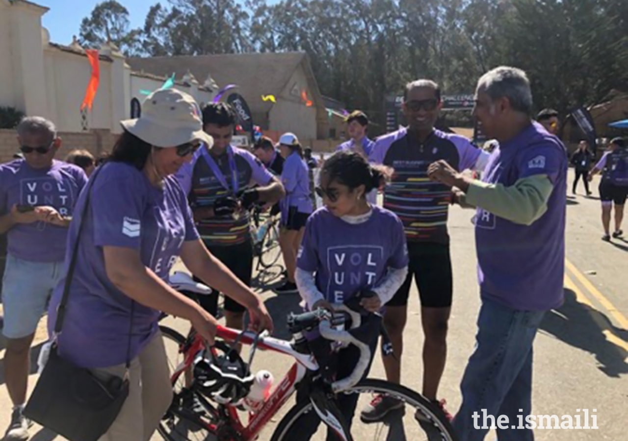 Volunteers in action, helping riders put away their bikes.