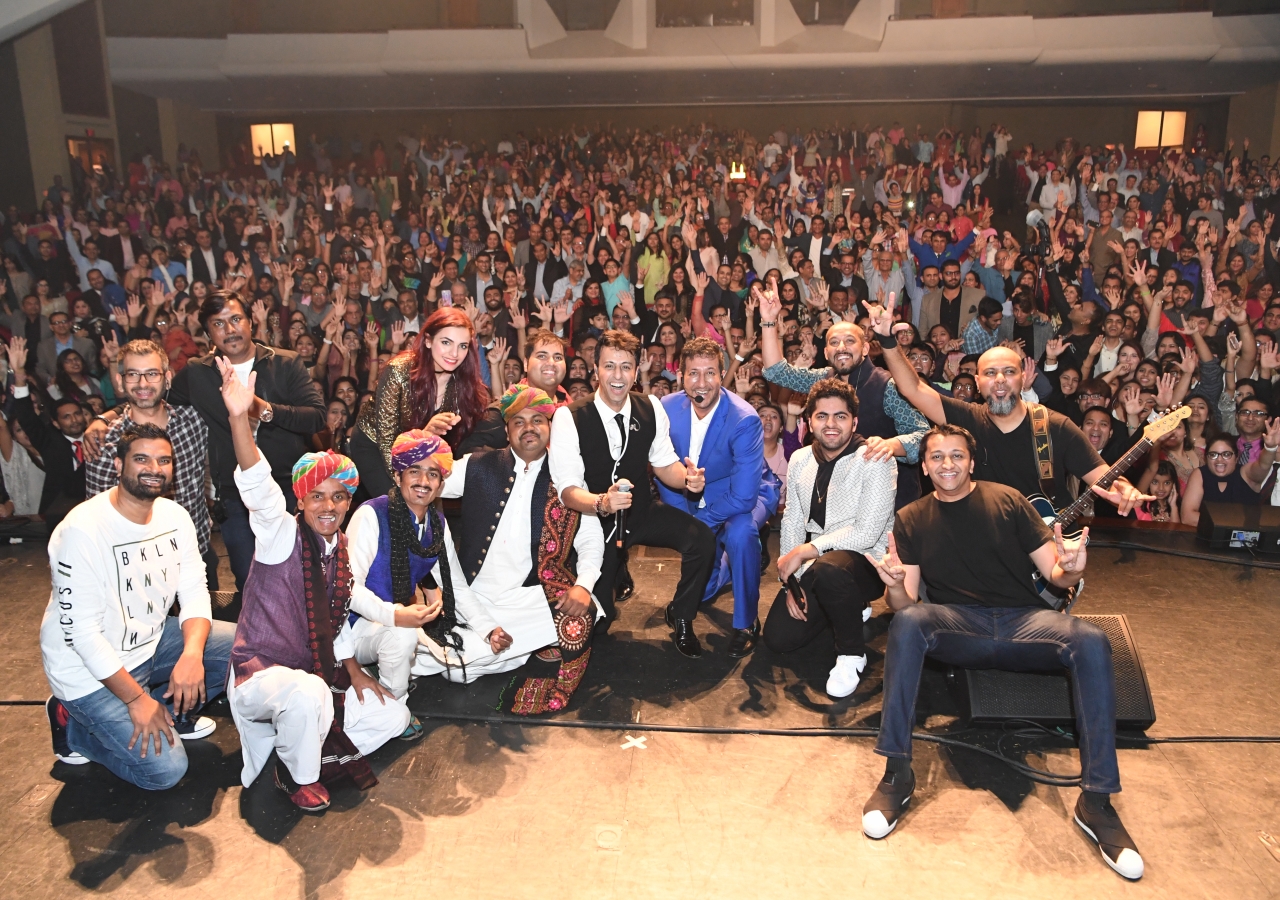 Salim-Sulaiman are joined by the band, performers, and all attendees for a group photo at their tour stop in Birmingham, Alabama.