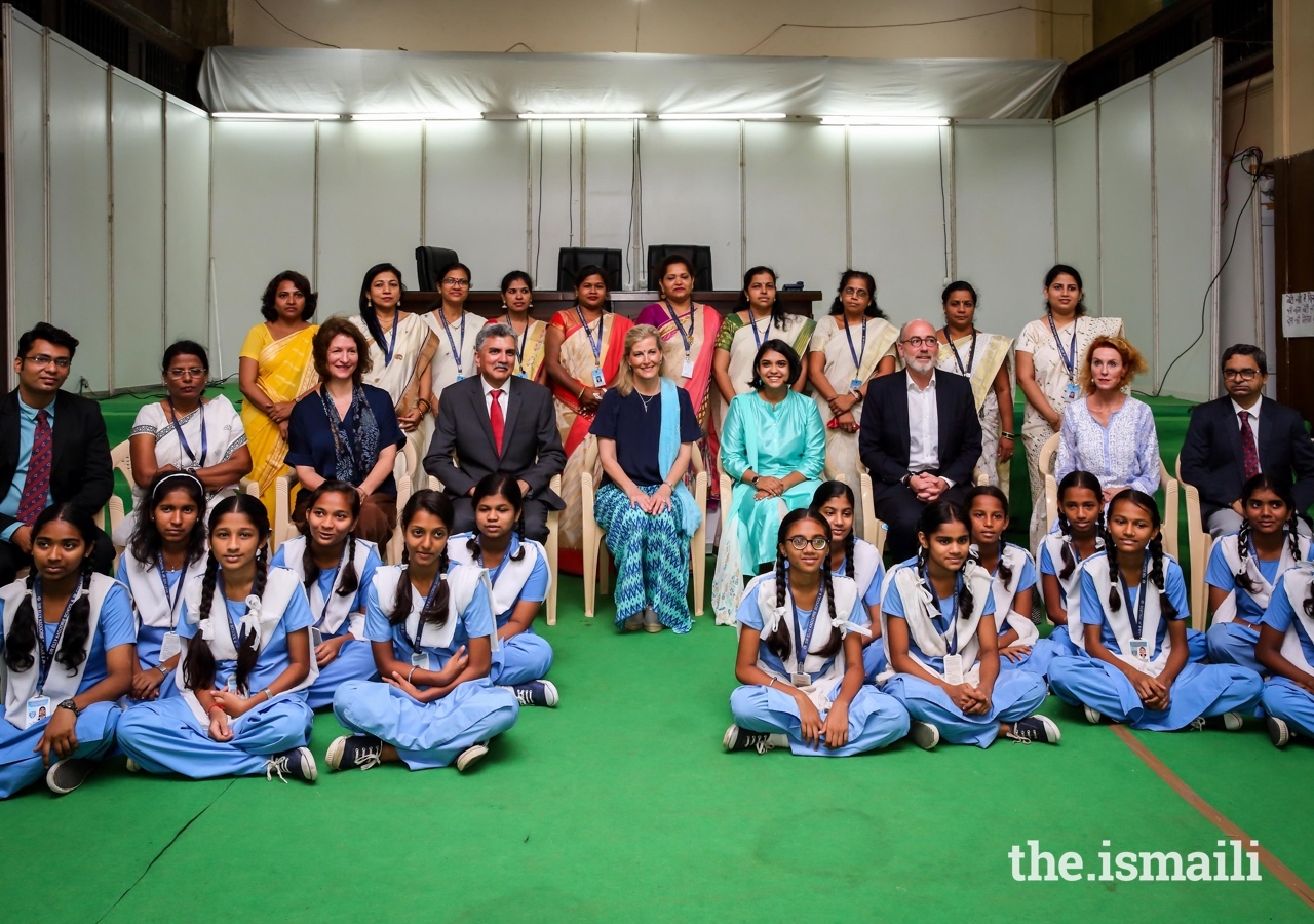 Her Royal Highness The Countess of Wessex (centre) poses for a group photograph with Crispin Simon, British Deputy High Commissioner for Western India, School children, teachers, and AKHS staff.