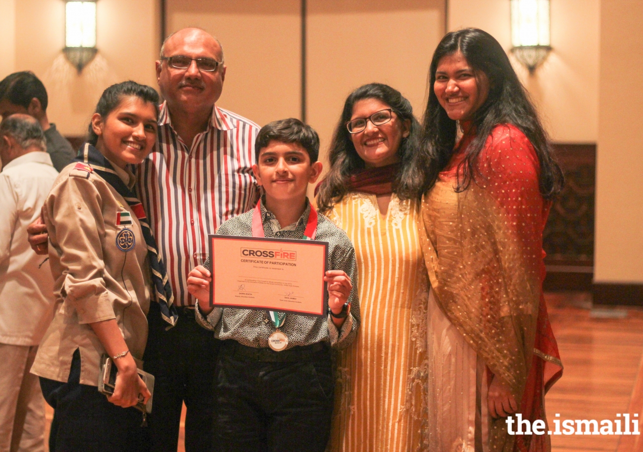 Sinan Aslam (11) celebrating his team’s win with family against the motion - “Climate change is currently the greatest threat to Earth”.