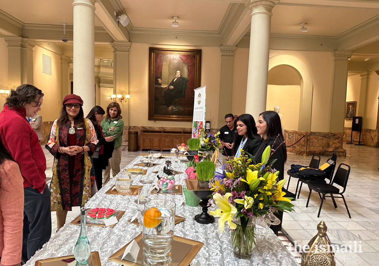 Visitors to the Haft-Sin display learn about the symbolisms associated with the ancient festival of Navroz.