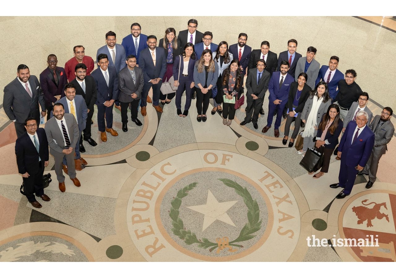 Participants looking up at the Rotunda during their tour of the Texas State Capitol Building.