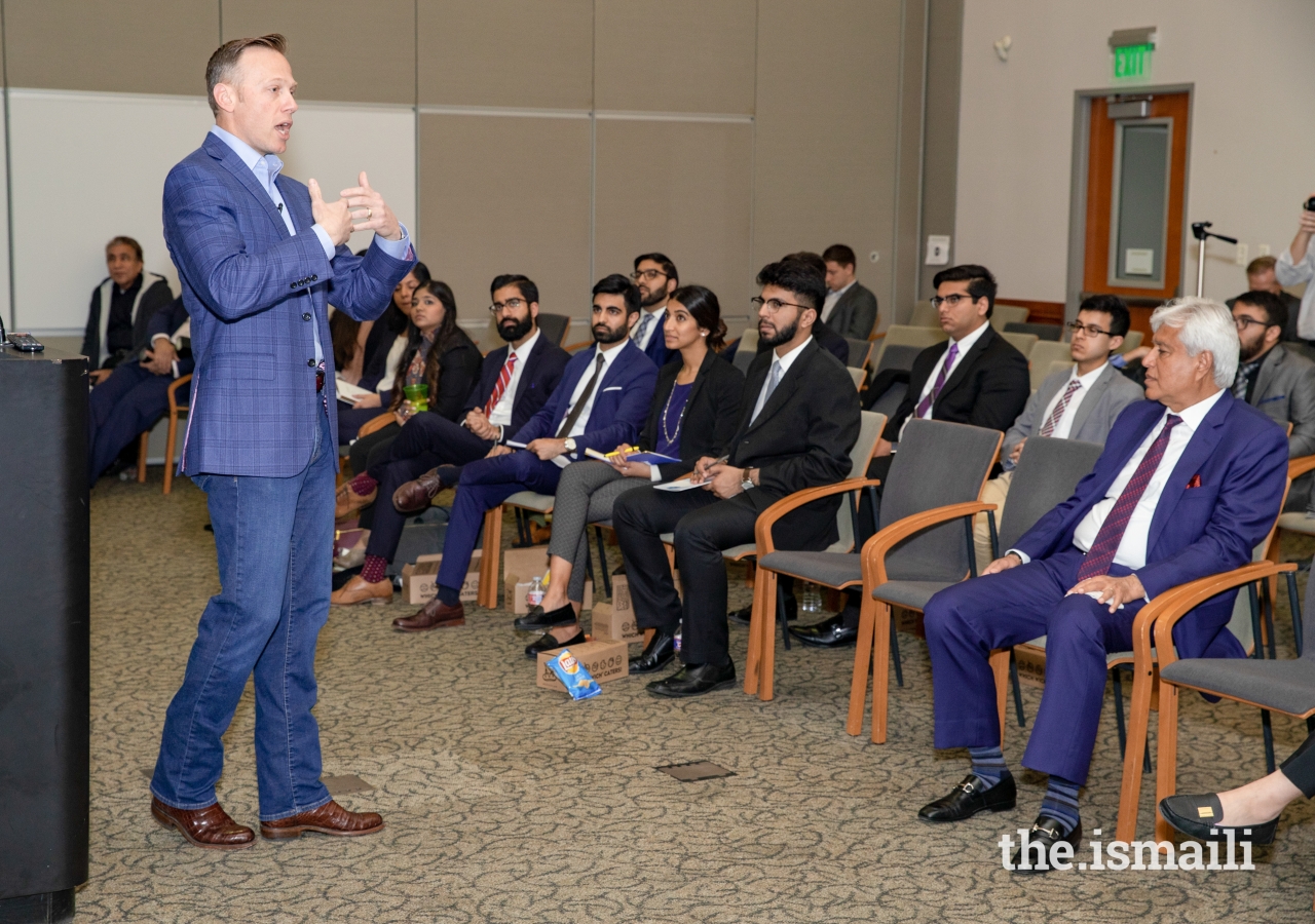 Texas Railroad Commissioner, Ryan Sitton, applauding the Ismaili community during his presentation, and also explaining his role and responsibilities as the Commissioner.