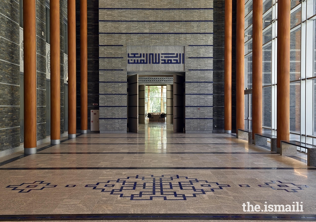 The social hall portal entrance at the Ismaili Jamatkhana and Centre, Khorog. The geometric Kufic script above the portal reads: “Al-hamdu lillahi rabil ‘alamin.”