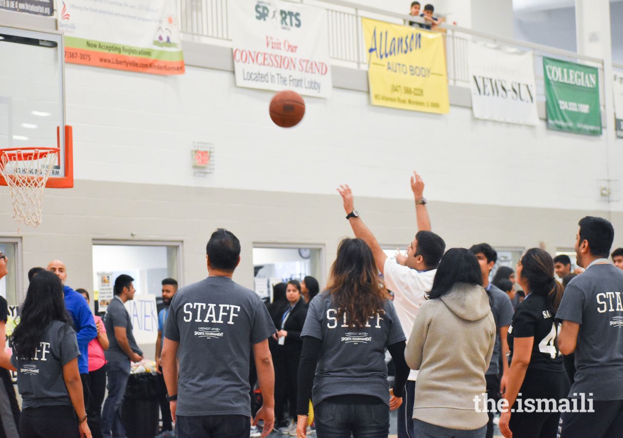 Arsheel Lalani takes an open shot as his teamates look on during the Ballin' with Buddies Exhibition Basketball Game.