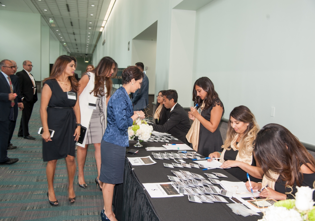 Volunteers registering the Jamat at the Rays of Light exhibition.