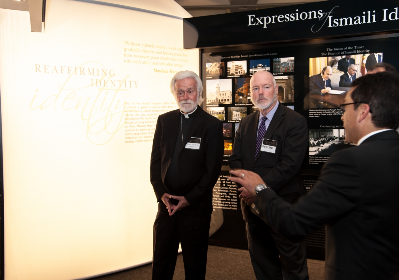 Dr. Adil Esmail (tour guide), Rt. Rev. Alexi Smith, and Danial Tamm from Human Relations, City of Los Angeles tour the exhibit.