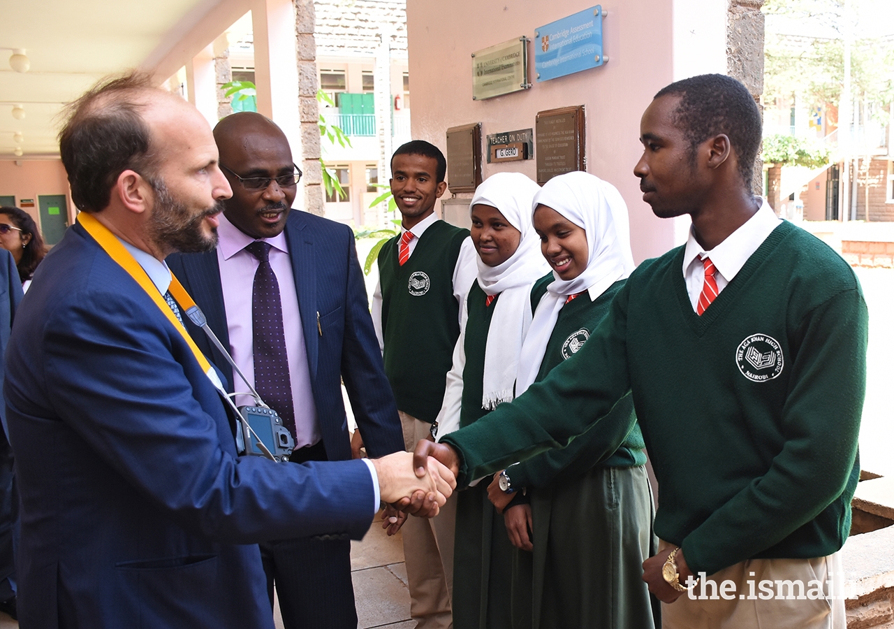 Principal Ambrose Maina introduces Prince Hussain to senior prefects during the Prince's visit to the Aga Khan High School, Nairobi.