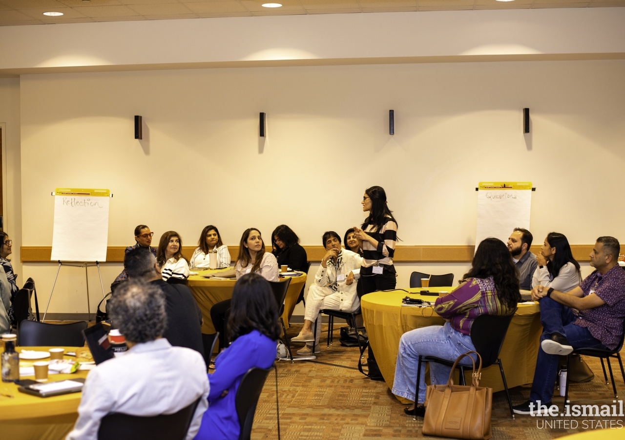 Nadia Lakhani is posing a question to President Al-Karim Alidina. 