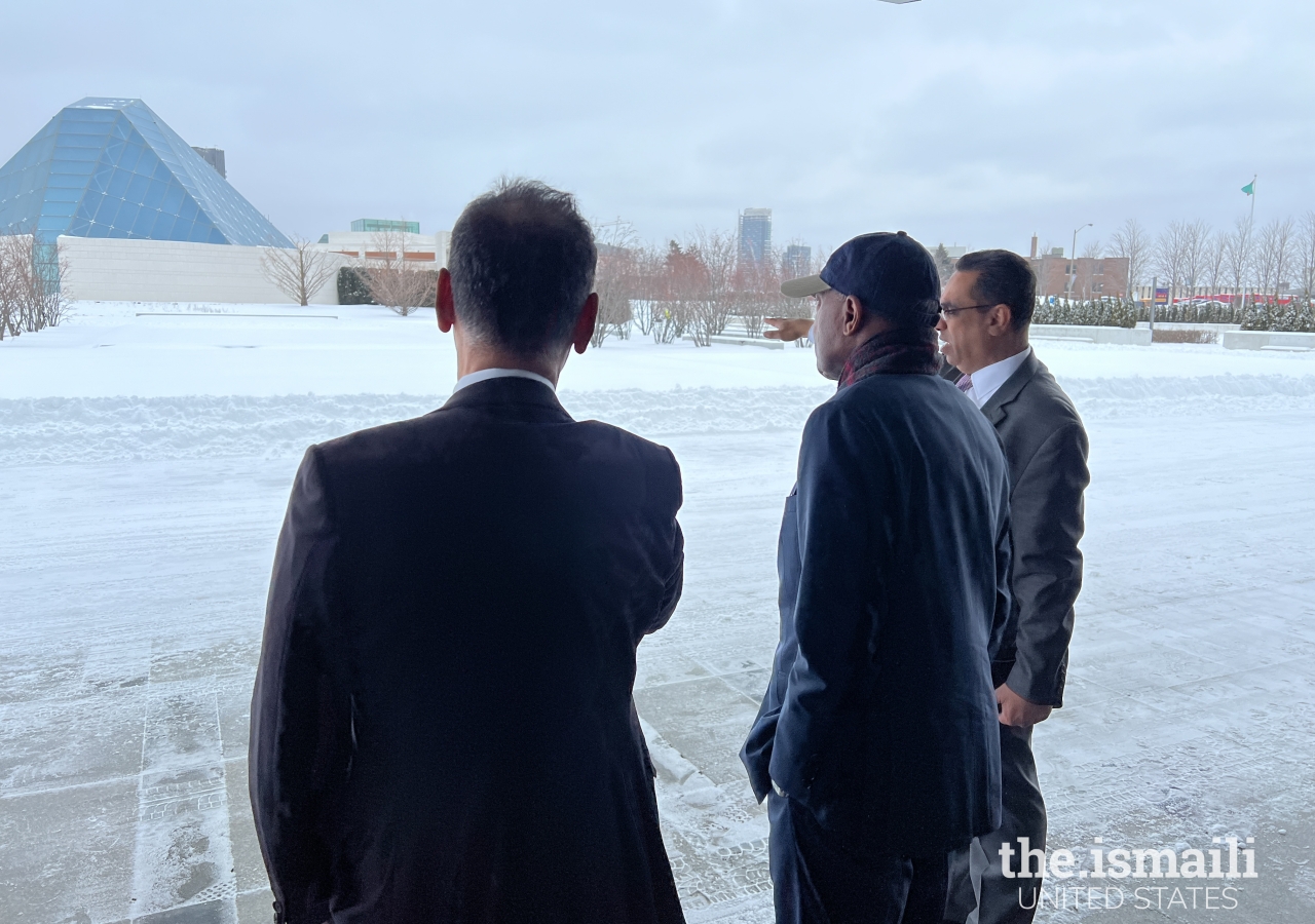 President Al-Karim Alidina and President of Ameerally Kassim-Lakha with Mayor Turner, discussing the Aga Khan Park with the Ismaili Centre, Toronto, in the background.