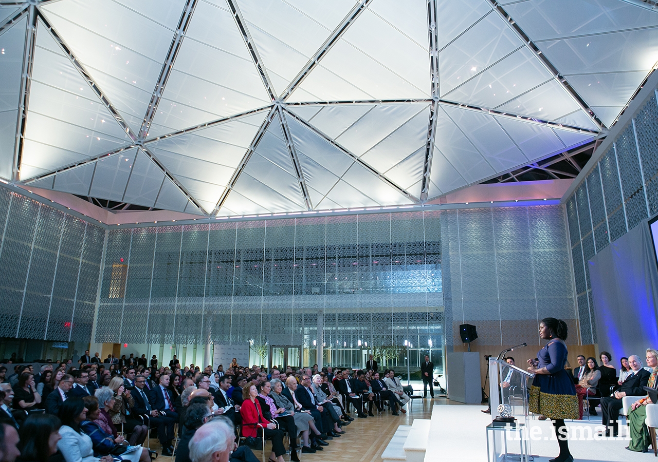 Deborah Ahenkorah accepts her award during the Global Pluralism Award ceremony held at the Delegation of the Ismaili Imamat in Ottawa, Canada.