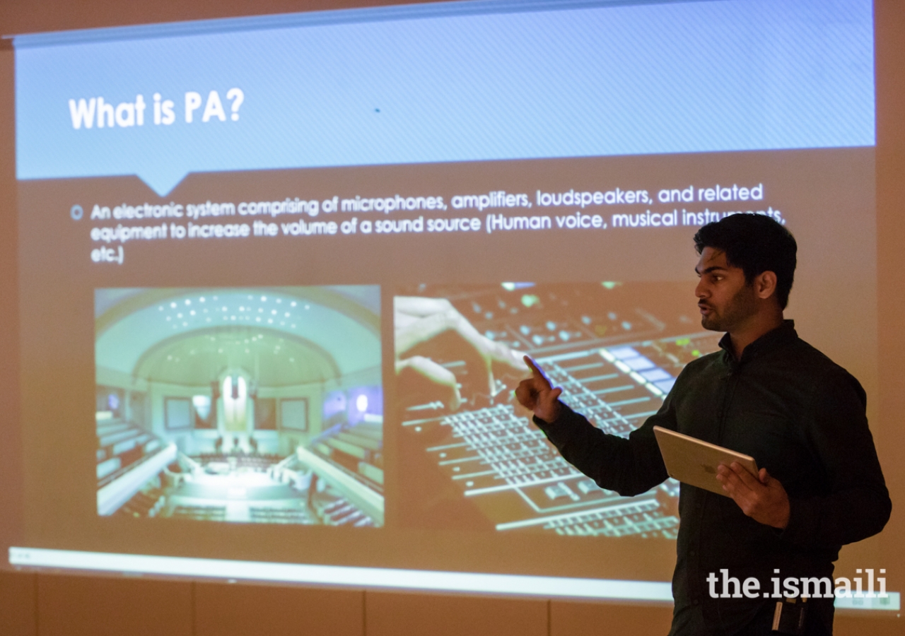 Workshop participants began their training with a few presentations;  here, Faizaan Momin is facilitating a session on audio systems.