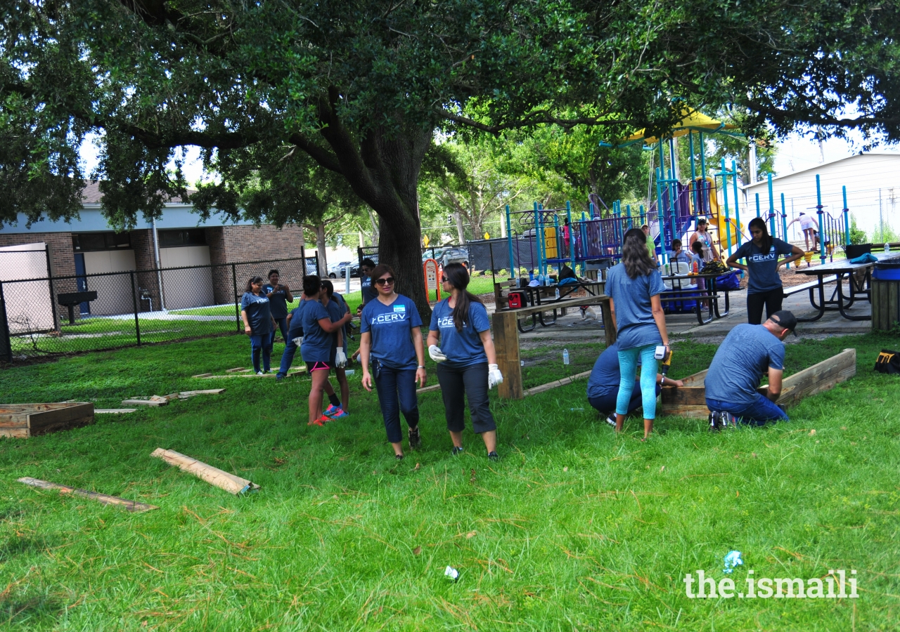 Volunteers at work making garden frames.