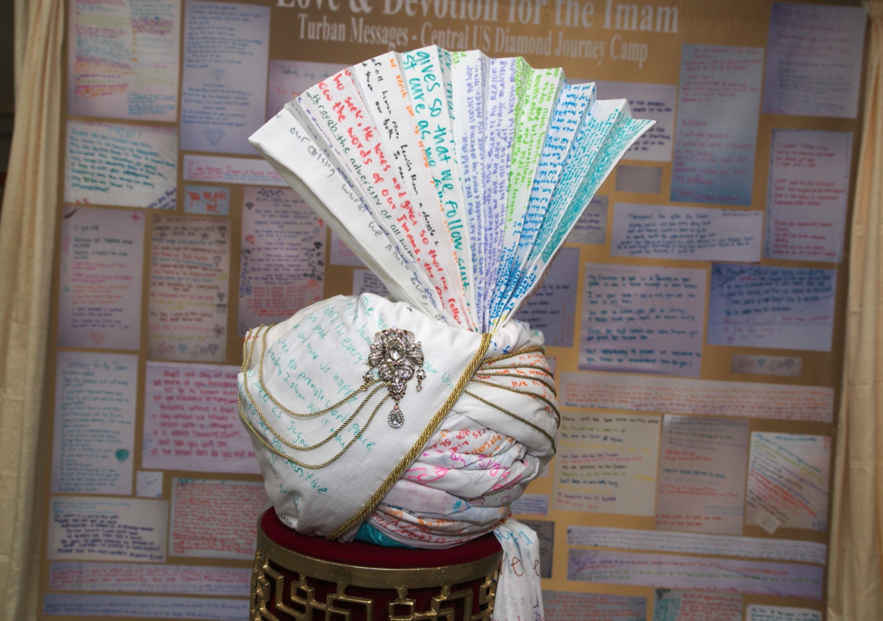 A turban of poems composed by youth sits on display at the Reflections Lounge. Many of the attractions on site were created by Jamati members during pre-Khushiali events.