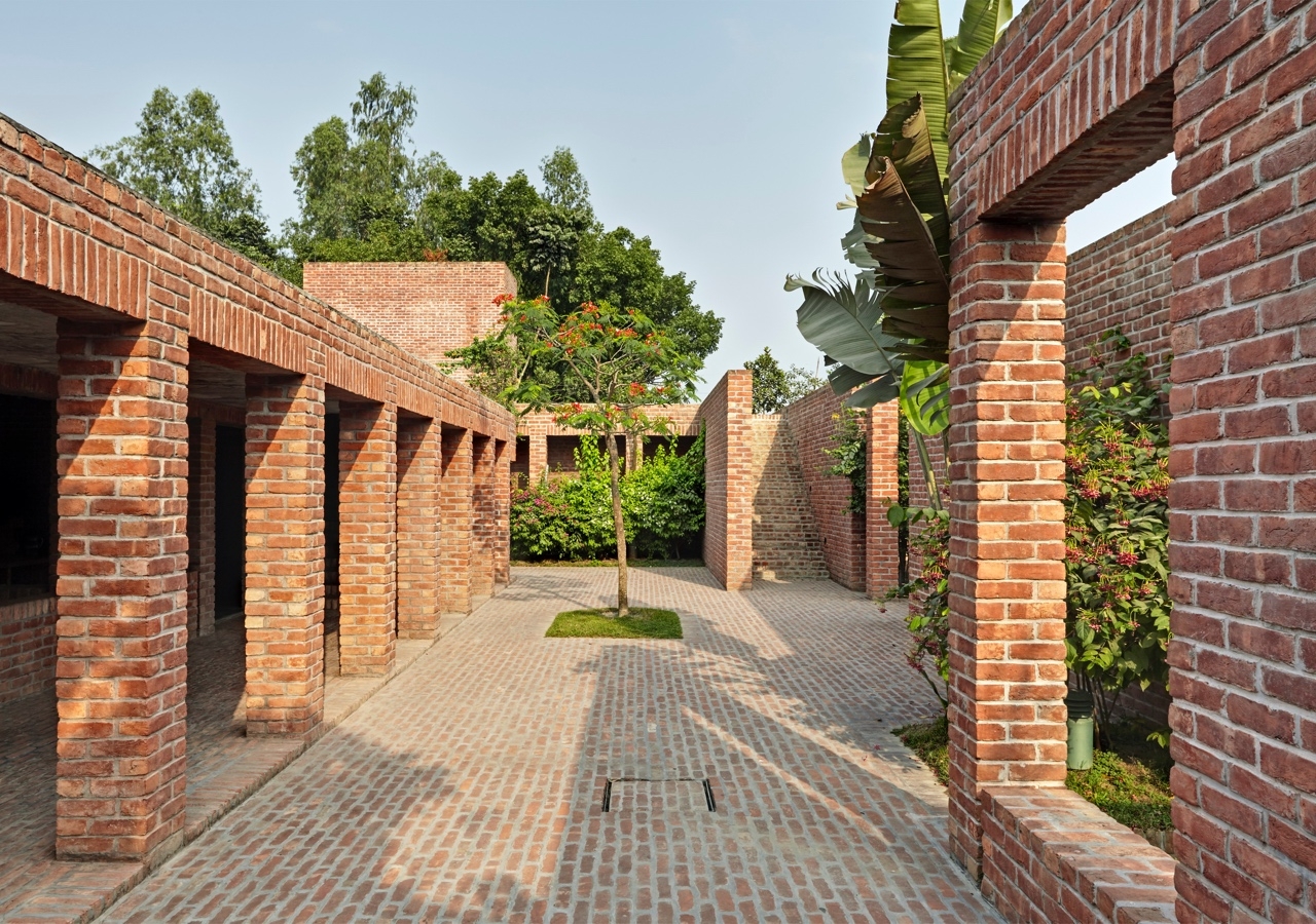 The inspiration for the Friendship Centre came from the Buddhist monasteries in the area, and the architectural influences include exposed brickwork, stark character, and a quadrilateral layout.