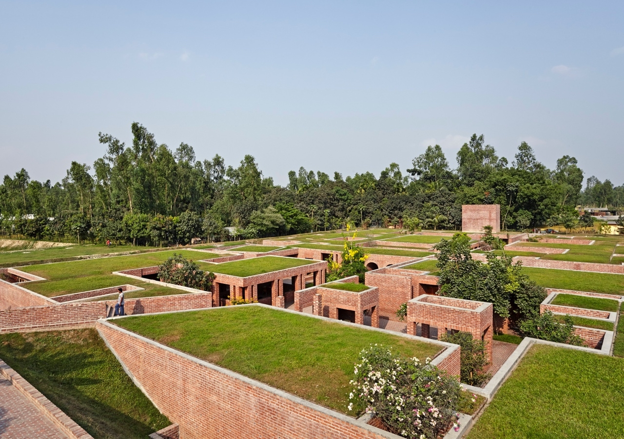 Located in rural Gaibandha where agriculture is predominant, the Friendship Centre's roofscape merges with its environment.