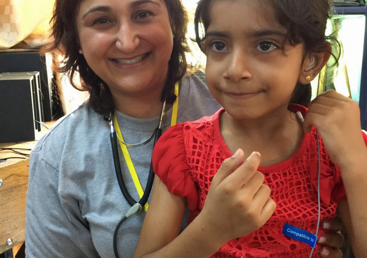 A child whose hearing was improved with a hearing aid