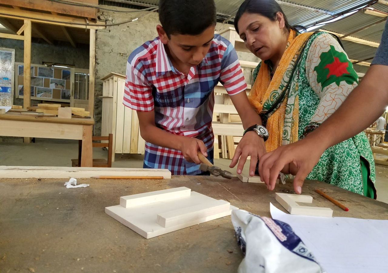 A Global Encounters participant gets some hands-on carpentry training at the CIQAM workshop