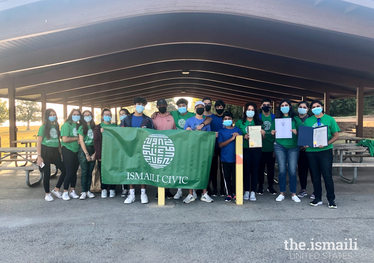 Group of volunteers prepared for park clean-up, planting, and painting.