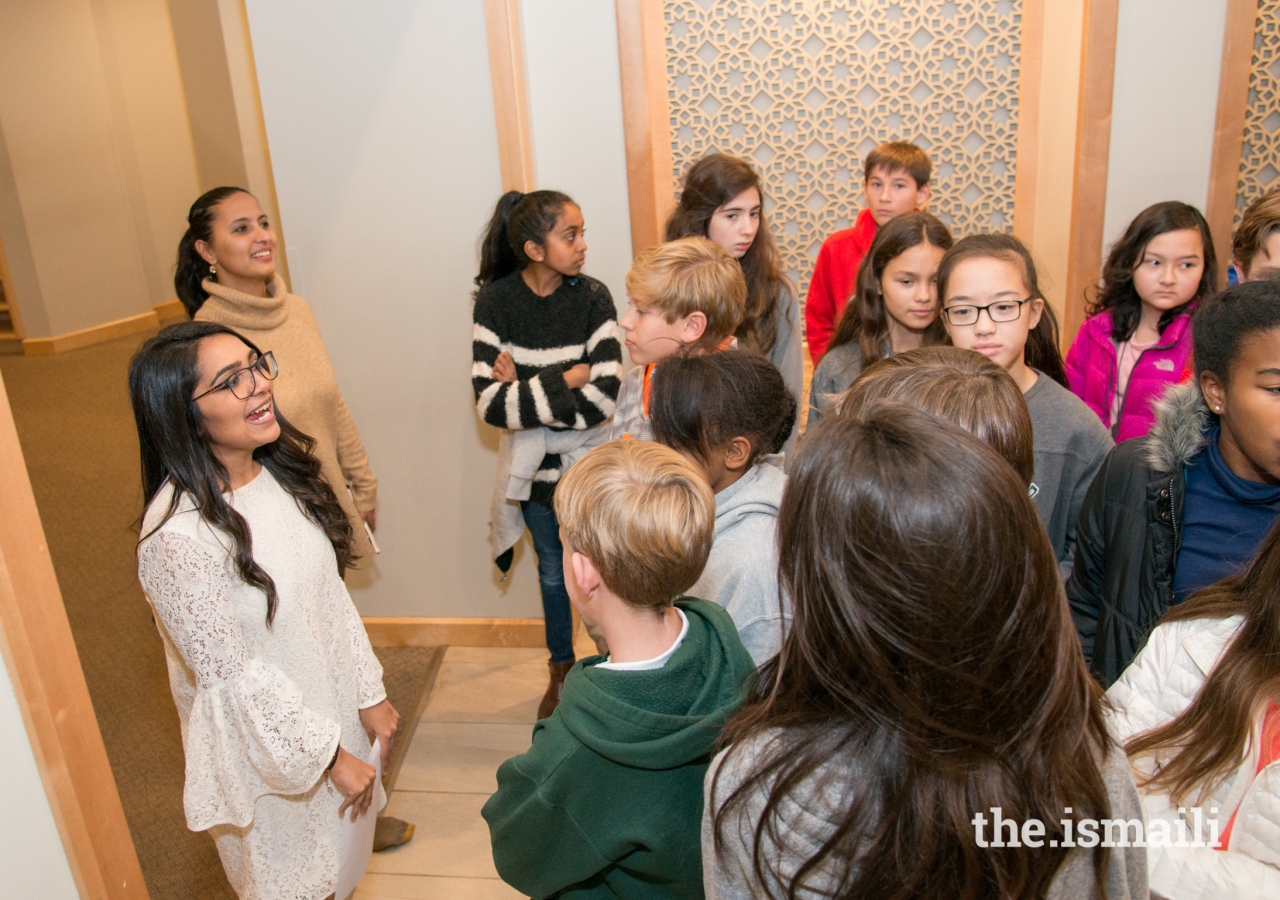 Sarosh Bhimani, requests the students’ attention as they prepare to enter the Prayer Hall of the Ismaili Jamatkhana.