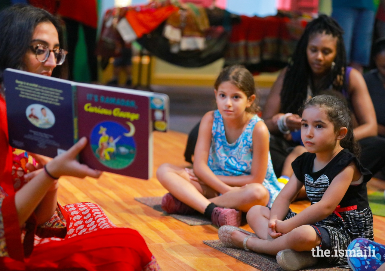 Laila Aziz reads a story to teach the young kids about Ramadan and the celebration of Eid-al-Fitr.