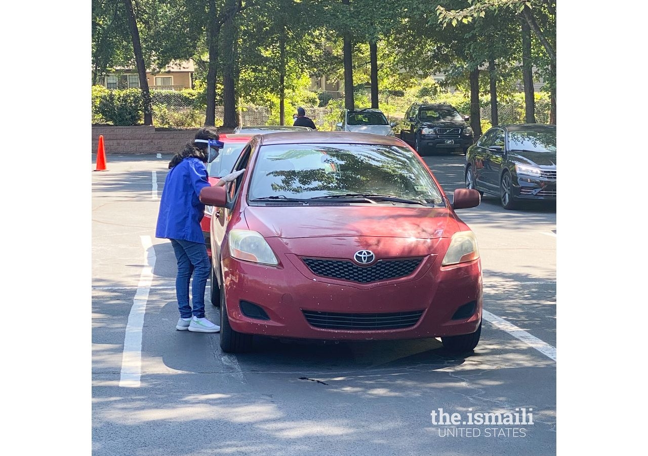 Bilingual volunteer pharmacists and pharmacy technicians from Walmart Pharmacy join Ismaili CIVIC (I-CERV) volunteers in administering COVID-19 vaccines to over 200 individuals at the Ismaili Jamatkhana in Atlanta.