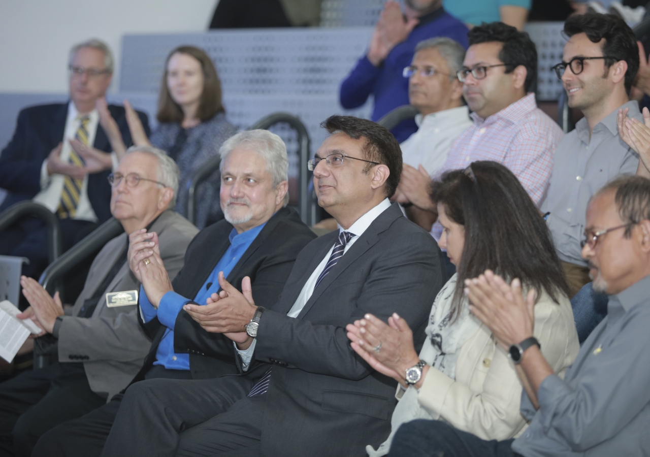 Dean Cole of the School of Architecture and Construction Management at KSU, and Prof Khan, Distinguished Professor of Architecture and Historic Preservation at Roger Williams University, listen to the introduction by Pres Murad Abdullah, at the event.