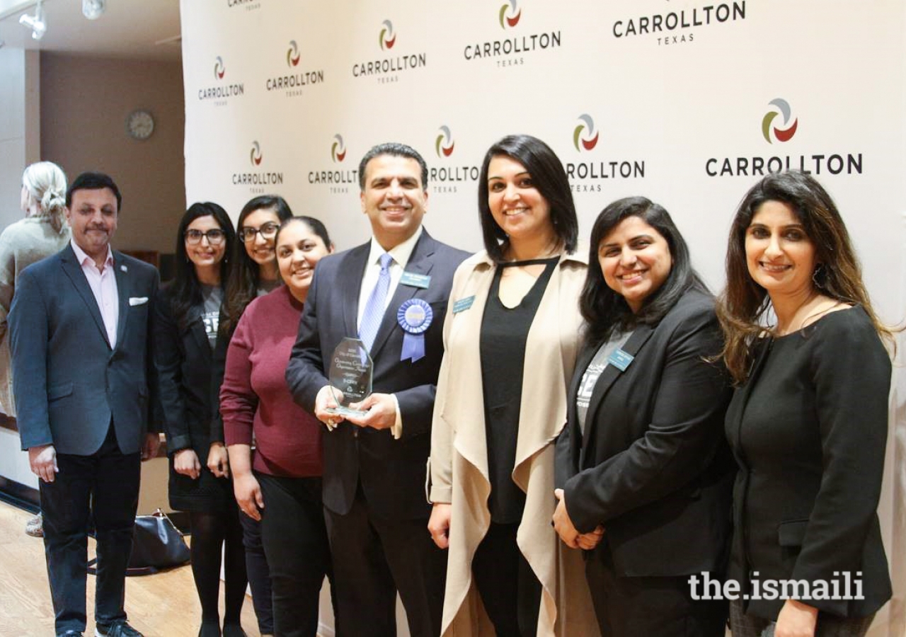 Leadership from the Ismaili Council for the Central United States display their award proudly.