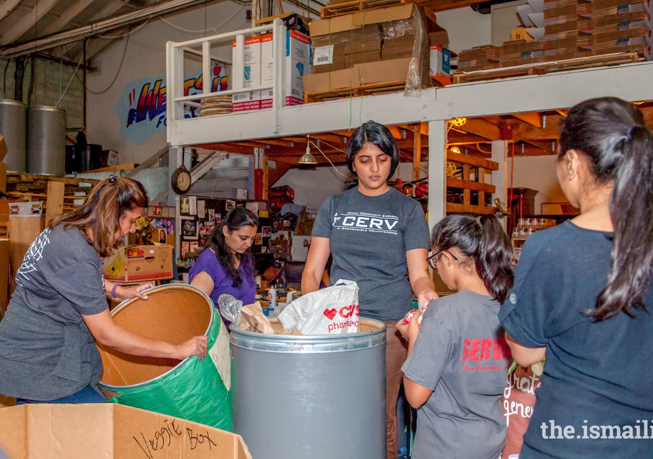 Greater Los Angeles: Volunteers sorting and boxing items at Westside Food Bank in Santa Monica.