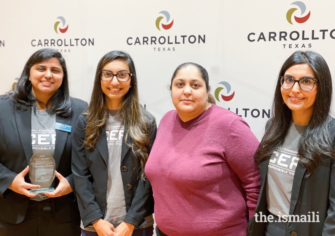 Representatives from the Aga Khan Youth and Sports Board for the Central United States celebrate the achievement of the volunteers in their region.