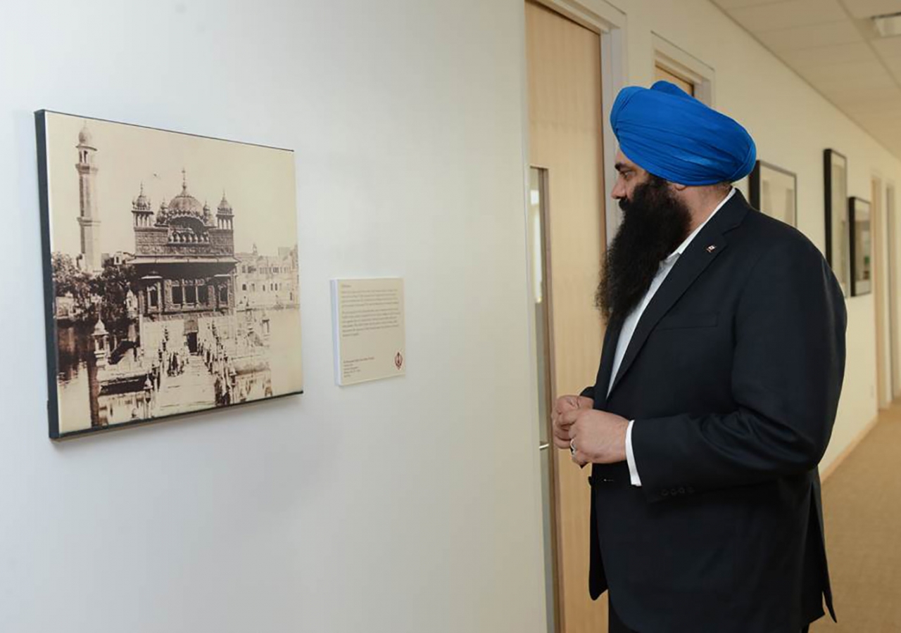 Federal multiculturalism minister Tim Uppal examines a photograph from the Faith &amp; Places exhibition at the Ismaili Centre, Toronto. Akbar Dewji