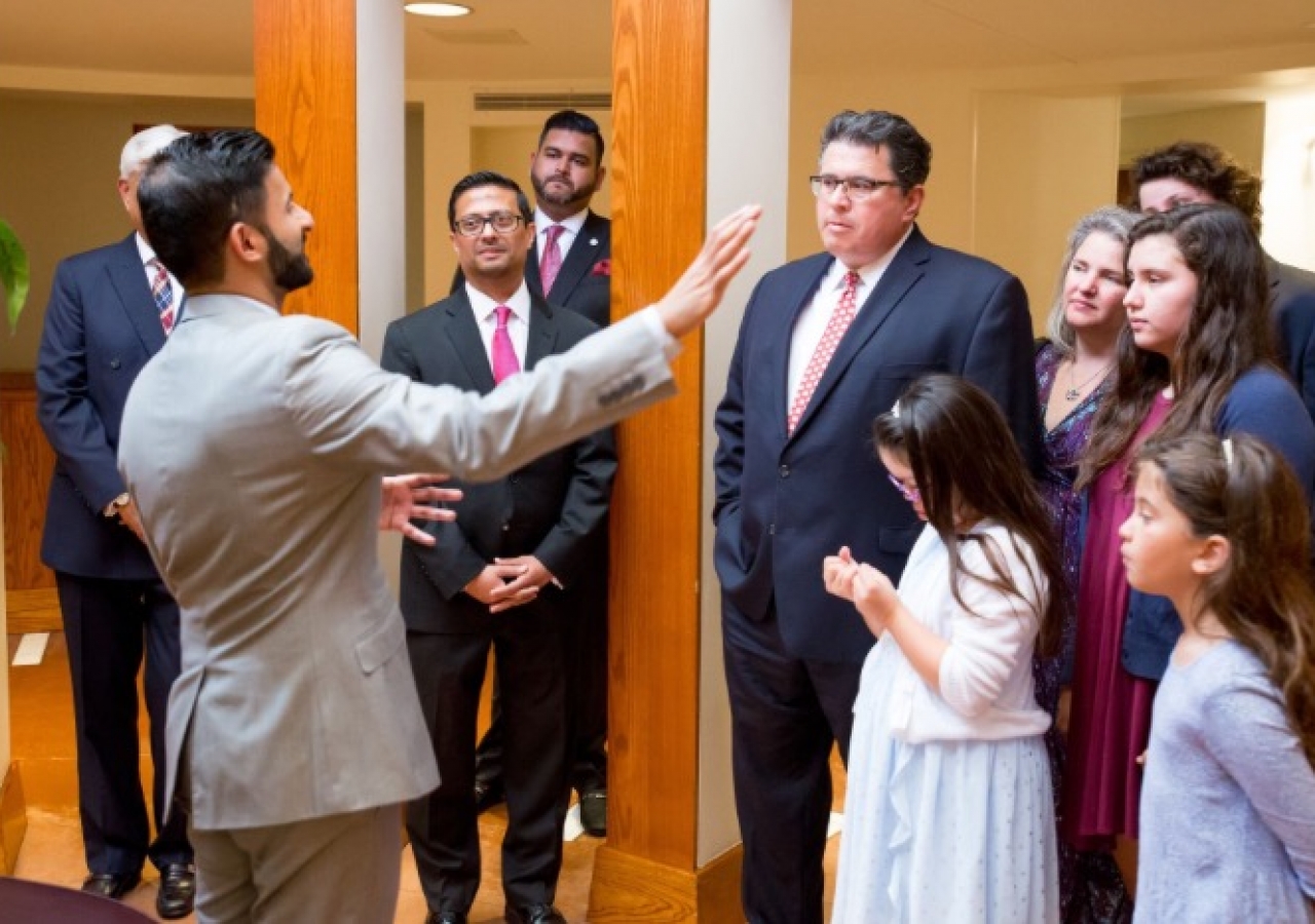 Texas Secretary of State Rolando Pablos receives a tour of the Ismaili Jamatkhana and Center along with his wife and ​their four children.