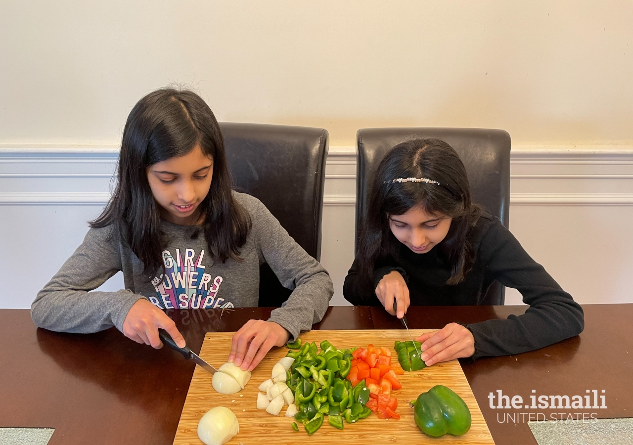 Simal & Sophia learning how to cook through a virtual class. 