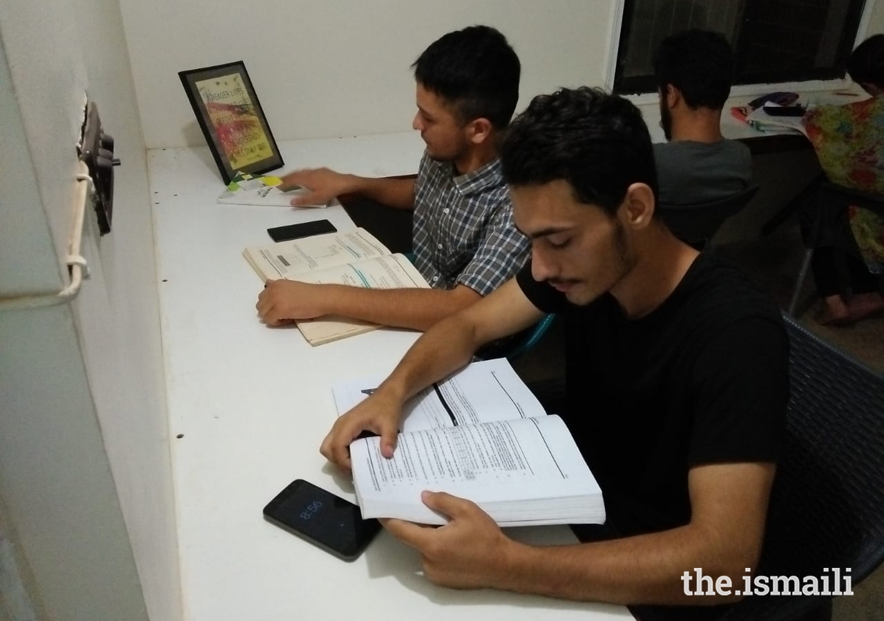 Young students study in the Gulshan-e-Noor Library and Reading Room.