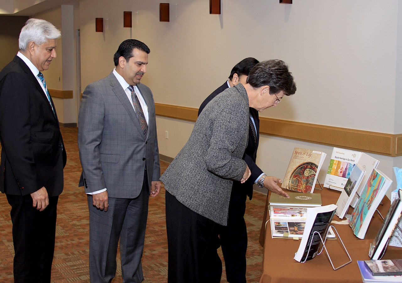 Mayor of Coppell, Karen Hunt, looking over the Golden Jubilee book.