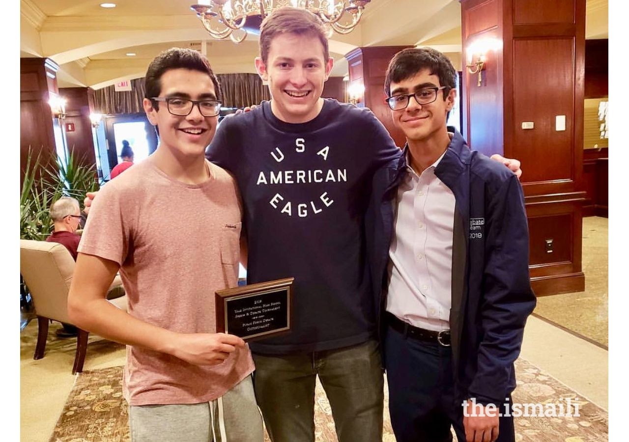 Taimur Moolji (left) and Saif Moolji (right), pose alongside their Coach Mr. Matthew Salah