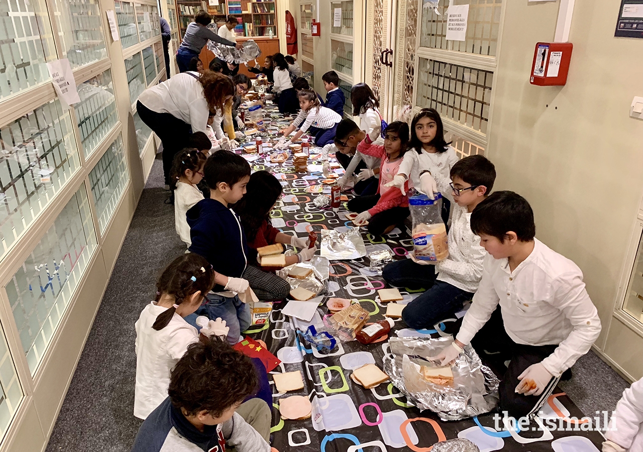 Children from Paris and Brussels Bait-ul Ilms were tasked with making more than 500 meals for the homeless.