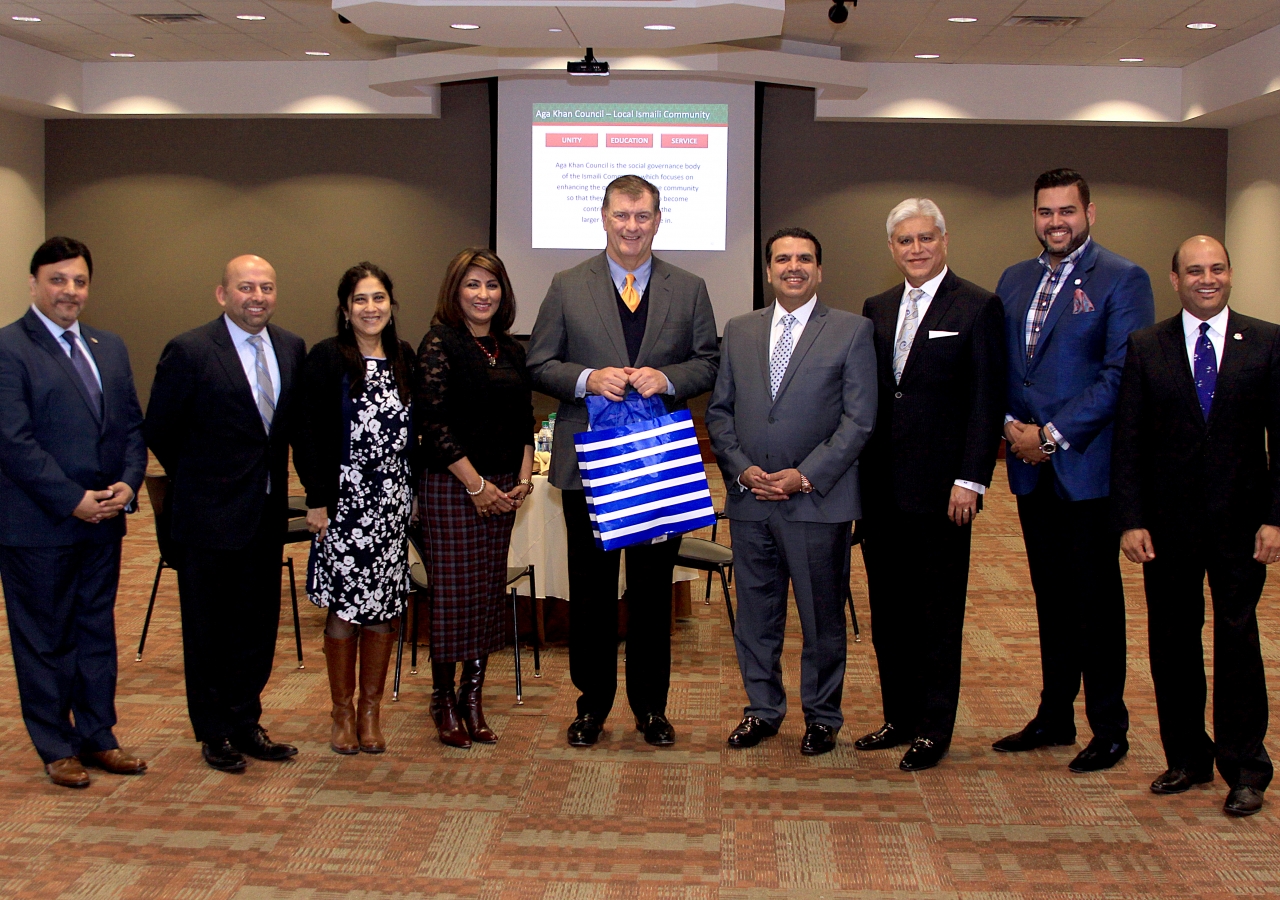 Mayor of Dallas, Mike Rawlings in the social hall of the Ismaili Jamatkhana, Plano with leaders and members.