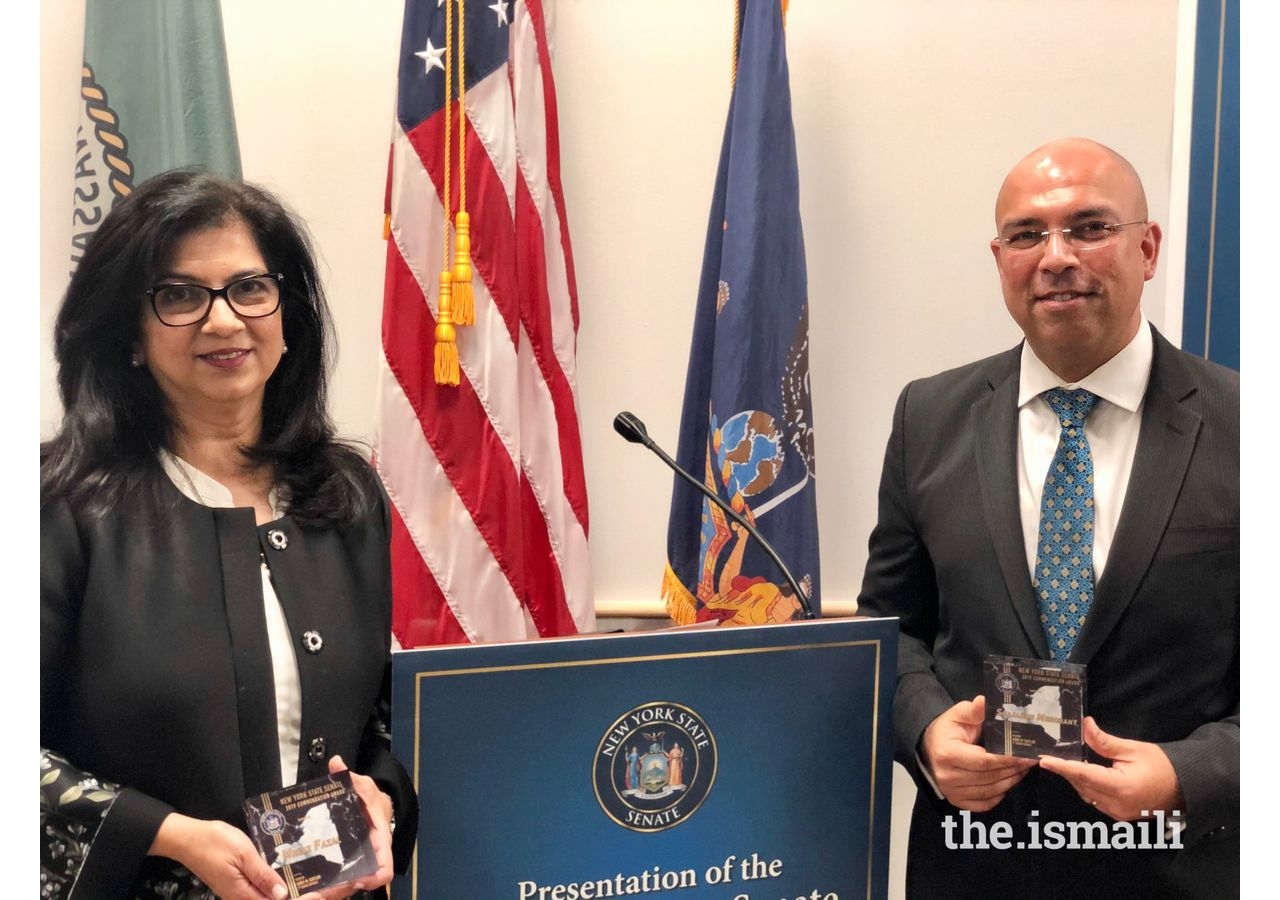 Minaz Fazal and Shajahan Merchant, posing with their awards.