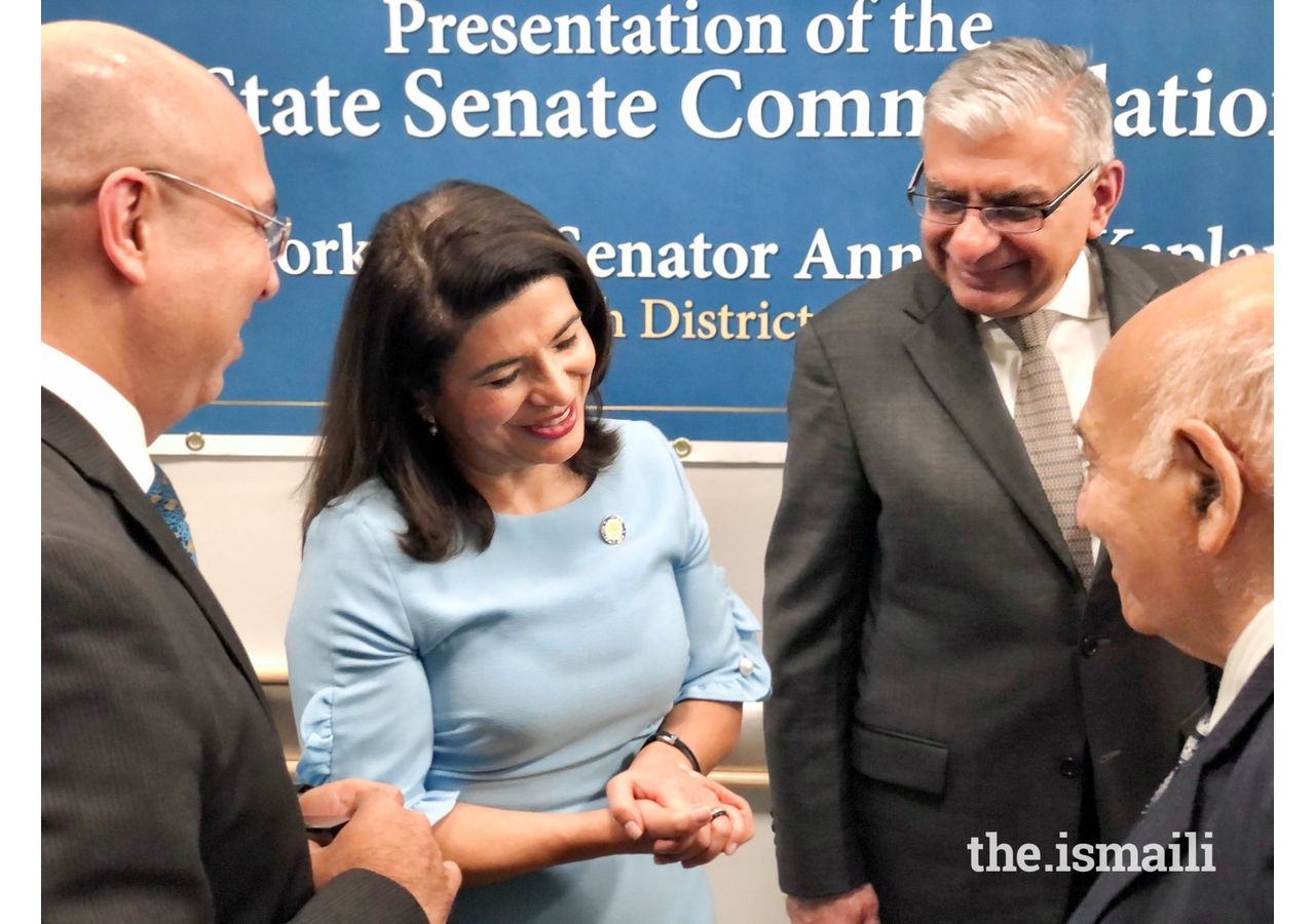 Anna Kaplan, New York State Senator, former Northeast Council President Shajahan Merchant, and former National Council President Barkat Fazal, meeting other attendees at the Award ceremony.