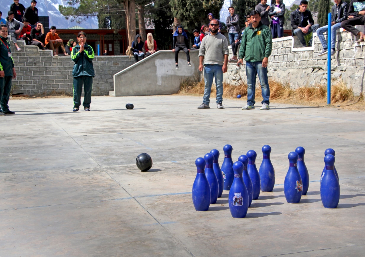 A girl participates in the bowling tournament organised in Gilgit.