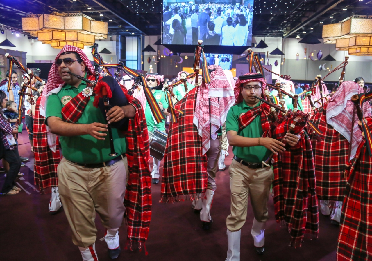 The marching band parades through the Global Village to kick off festivities. JG/Ahmed Charania