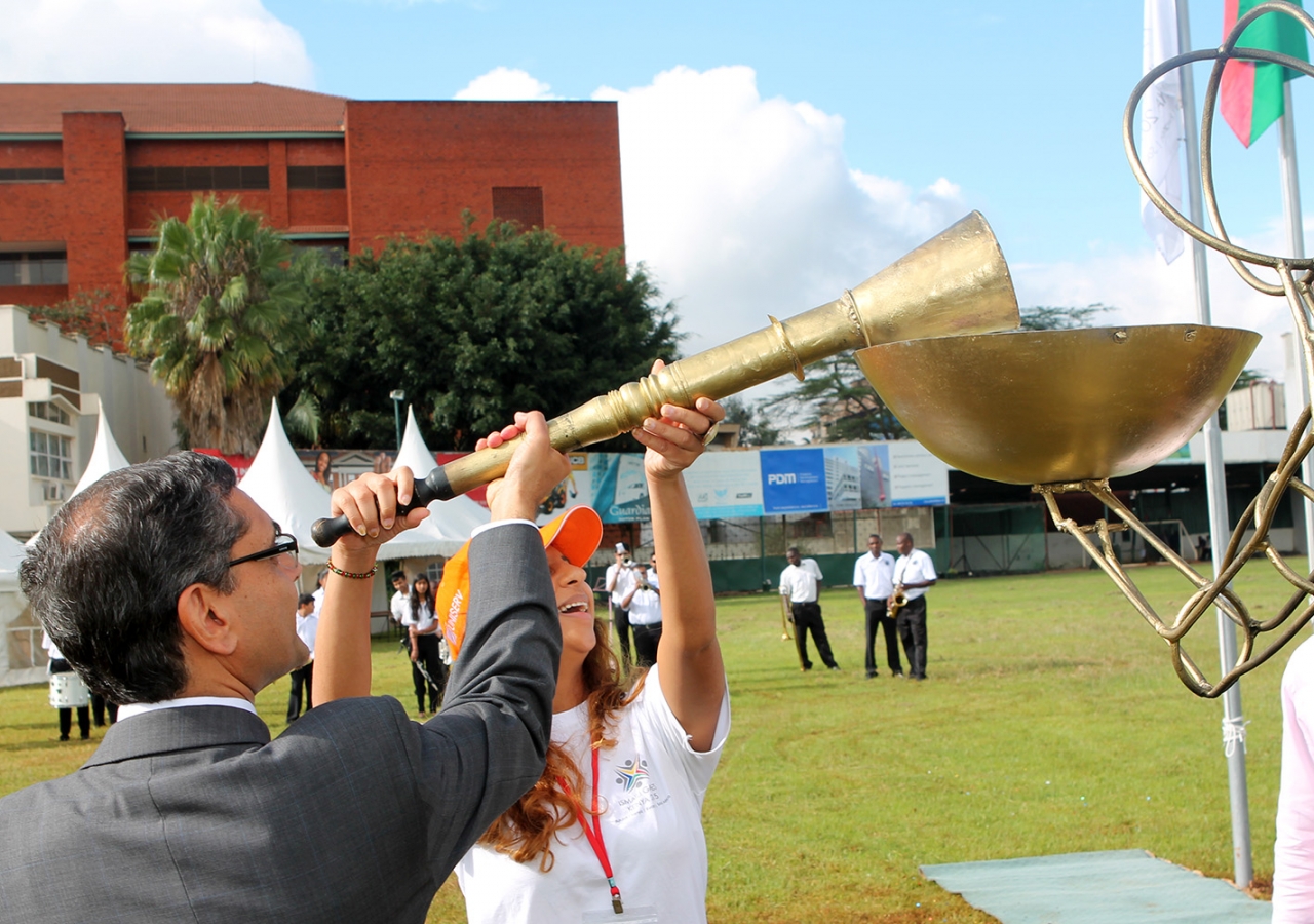 Ismaili Council President Nawaaz Gulam and National Team Kenya Games Coordinator Reshma Khan light the torch symbolising the start of the Ismaili Games Kenya 2015. Ejaz Karmali