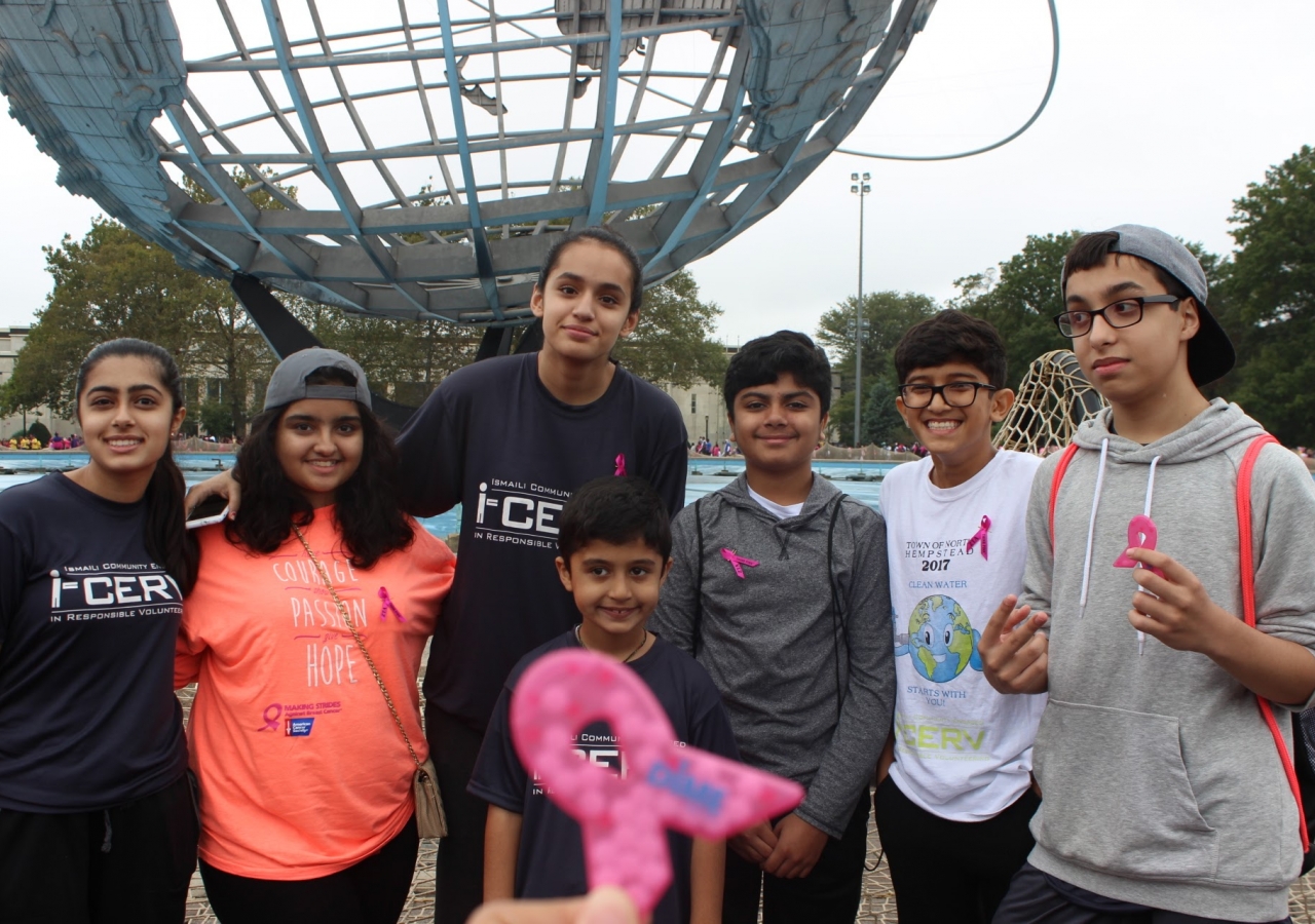 Volunteers of all ages proudly showcase their I-CERV shirts and Breast Cancer ribbons.