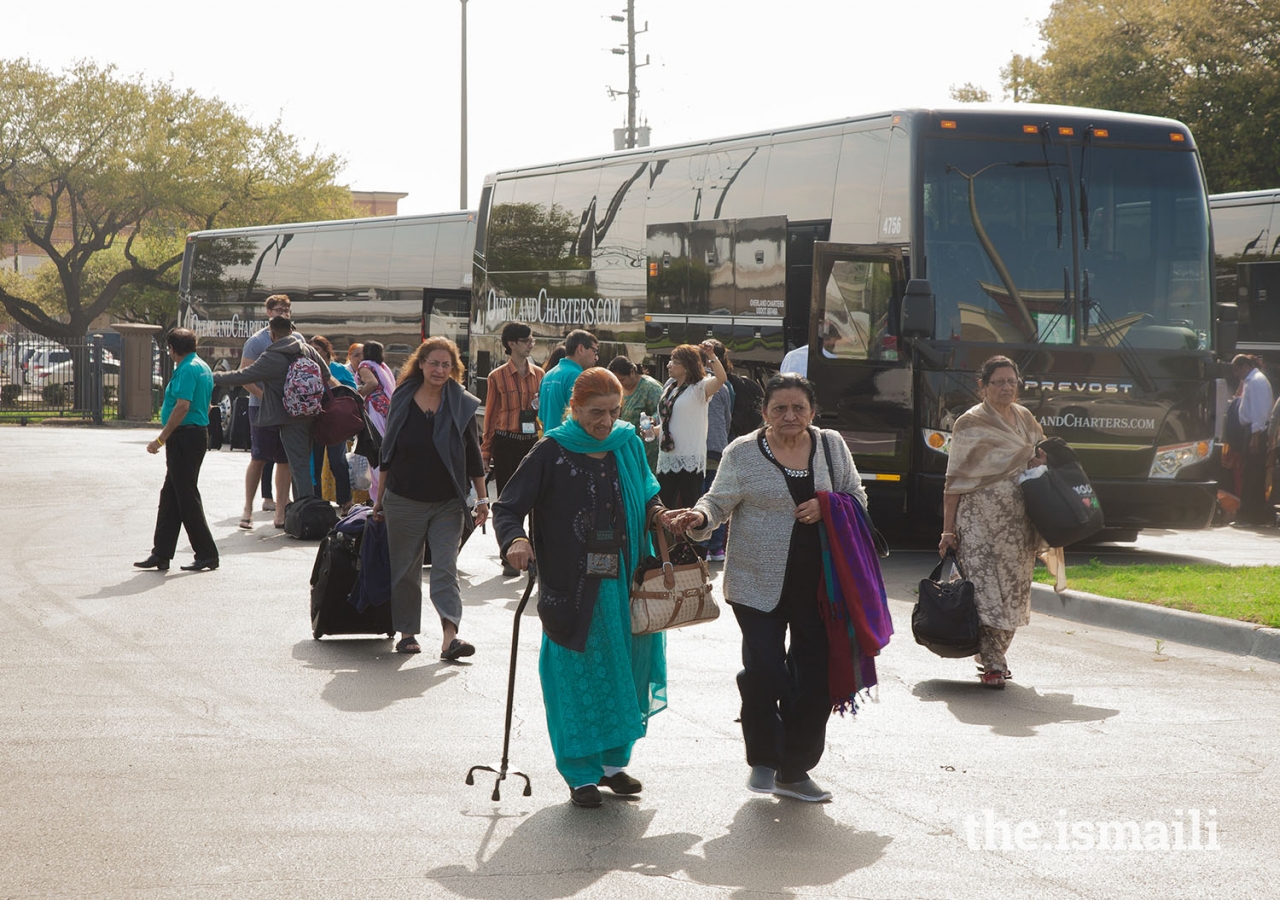 Seniors from the Dallas/Fort Worth area arrive in Houston on shuttles driven by Jamati volunteers.