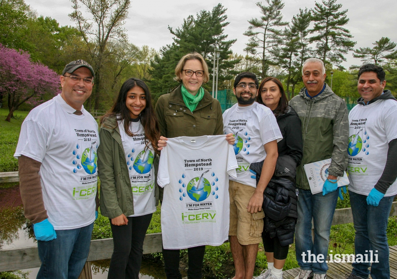 I-CERV Volunteers presenting Councilwoman Veronica Lurvey with a T-shirt commemorating Earth Day 2019.