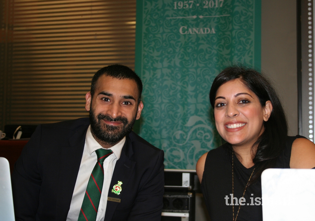 Aleem and Natasha Mawji working at the registration desk.