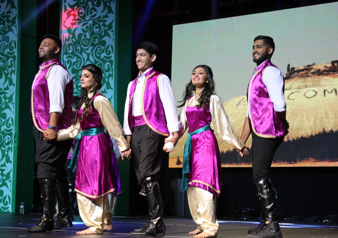 The One Jamat celebration program featured more than a dozen volunteers performing dances from a variety of global traditions where the Jamat is present.