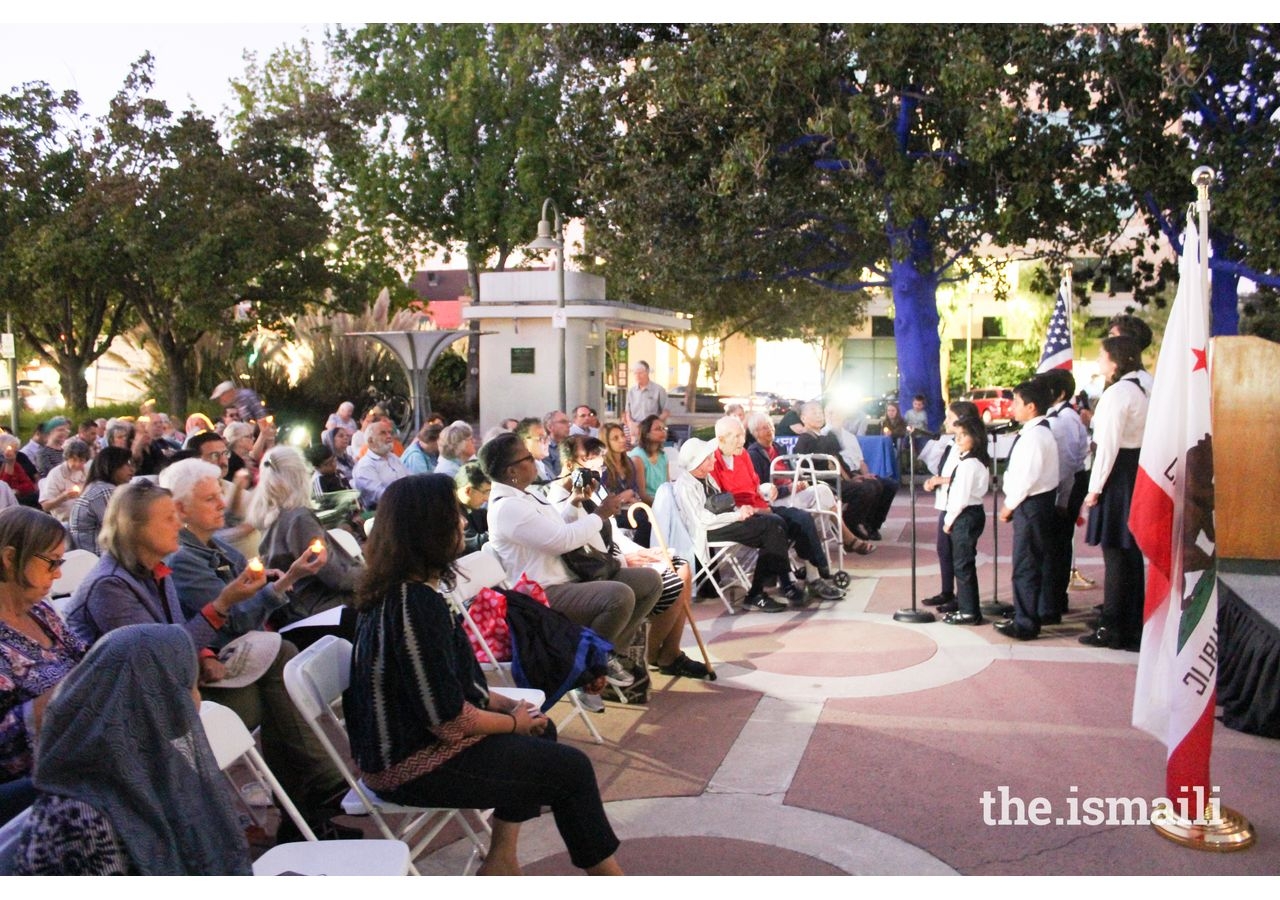 The Bay Area Ismaili Choir performs to a crowd outside Palo Alto City Hall on September 11, 2019.